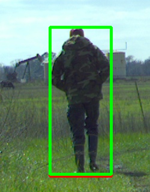 Zoomed view of frame 240 around the worker. Green box is YOLO's predicted person at conf 0.356, which is well below the 0.5 cutoff so the evaluator counts the frame as a false negative. Red box is the GT person component. The two boxes are essentially identical in position and size, confirming that the localization is right and only the calibrated confidence on this particular crop is the issue.